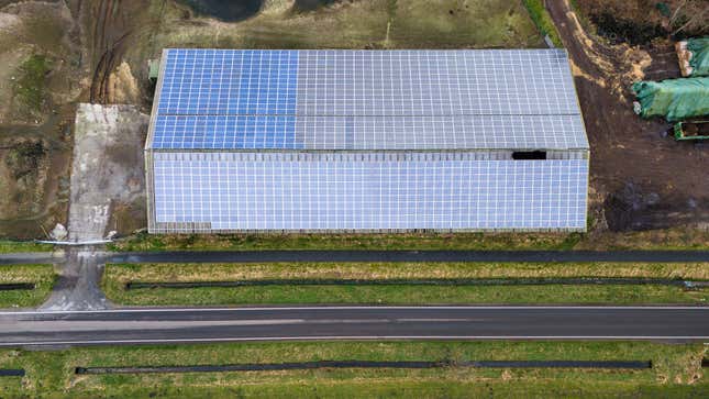 A photovoltaic system is installed on a building in Sprakebuell, Germany, Thursday, March 14, 2024. Sprakebuell is something of a model village for the energy transition - with an above-average number of electric cars, a community wind farm and renewable heat from biogas. All houses in the village center have been connected to the local heating network and all old oil heating systems have been removed. (AP Photo/Frank Molter)