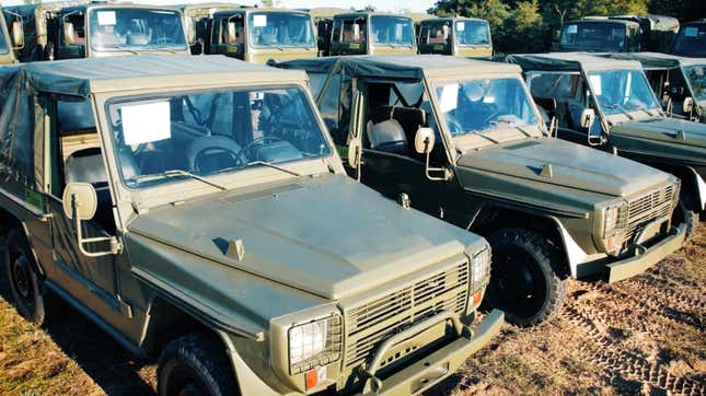 A row of Peugeot P4 military trucks