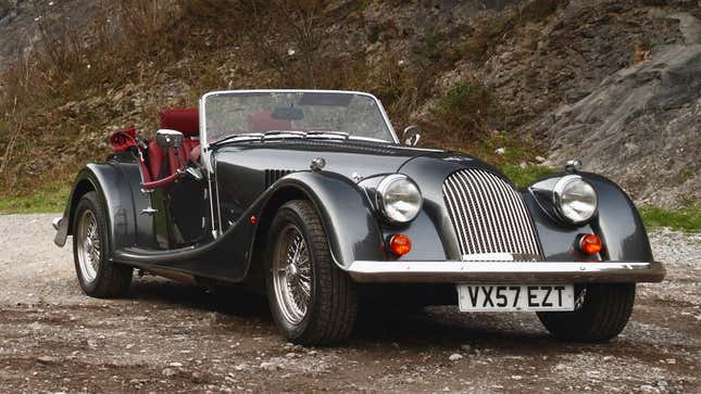 A photo of a grey Morgan Plus Four convertible. 