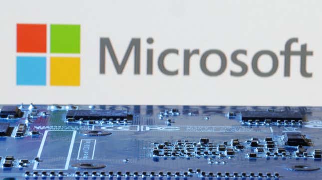 Microsoft logo is seen near computer motherboard in this illustration taken January 8, 2024.