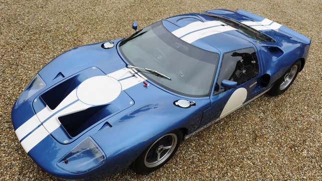 A photo of a blue Ford GT40 with white stripes down the middle. 