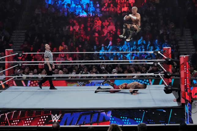 Wrestler Akira Tozawa goes airborne during his match with Carmelo Hayes during the WWE Monday Night RAW event, Monday, March 6, 2023, in Boston. WWE’s popular television show, “Friday Night Smackdown,” will be moving from Fox to USA Network next year under a new five-year domestic media rights partnership with NBCUniversal, Thursday, Sept. 21, 2023. “Smackdown” will begin airing on USA Network in October 2024.(AP Photo/Charles Krupa)