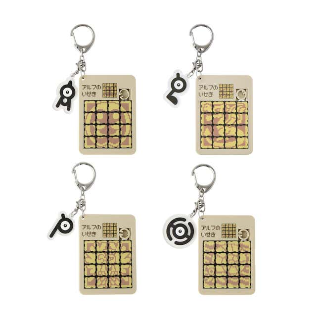 Keychains that include slider puzzles of in-game Pokémon murals, adorned with Unown charms. 