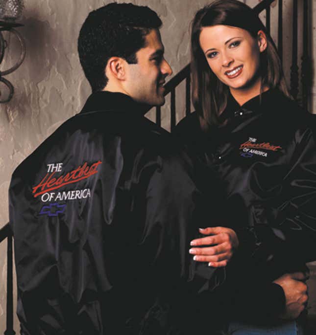 Two models wearing a black satin Chevrolet "The Heartbeat of America" jacket