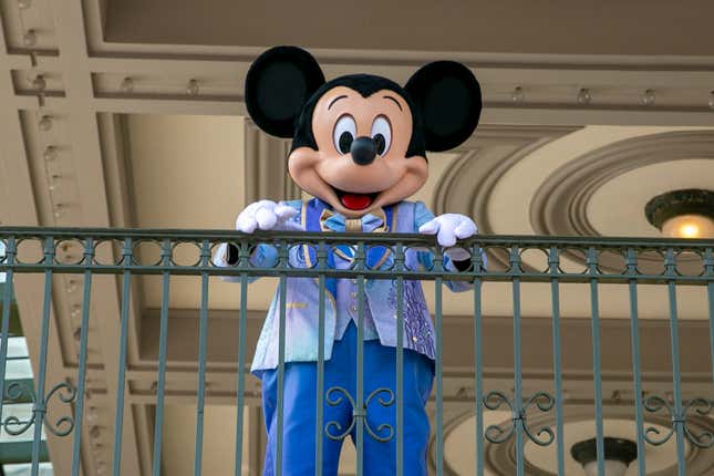 FILE - An actor dressed as Mickey Mouse greets visitors at the entrance to Magic Kingdom Park at Walt Disney World Resort, April 18, 2022, in Lake Buena Vista, Fla. The earliest version of Disney&#39;s most famous character, Mickey Mouse, and arguably the most iconic character in American pop culture, will become public domain on Jan. 1, 2024. (AP Photo/Ted Shaffrey, File)