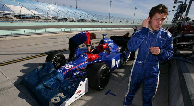 A young Marco Andretti puts his ear protection in at the track