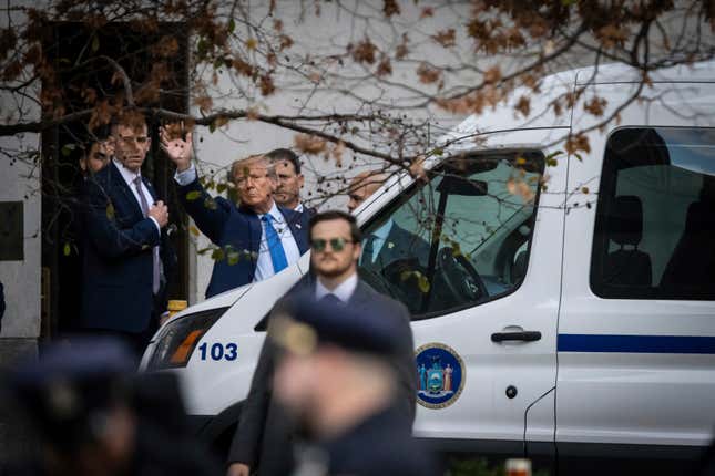 Former President Donald Trump waves as he leaves the New York Supreme Court, Monday, Nov. 6, 2023, in New York. (AP Photo/Stefan Jeremiah)