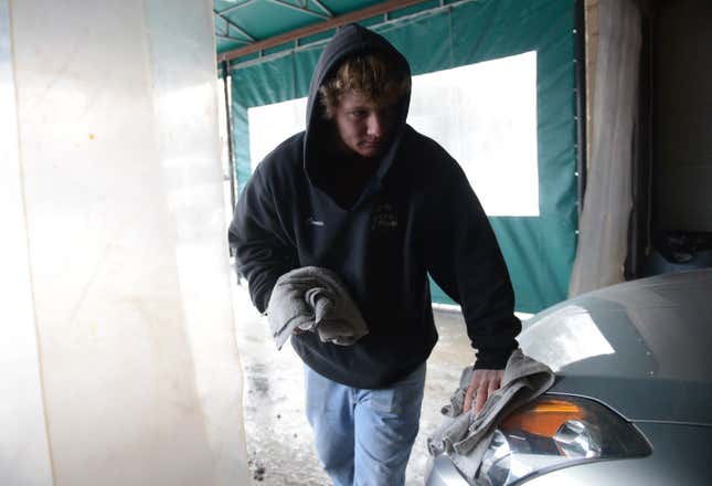 Cold Weather work Connor Barren, hand dries cars at Scott’s Car Wash in Exeter Township. 