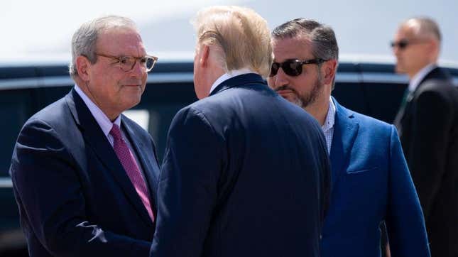 Then President Donald Trump greets El Paso Mayor Dee Margo, left, and Senator Ted Cruz, right, as he disembarks from Air Force One upon arrival at El Paso International Airport in El Paso, Texas, August 7, 2019.