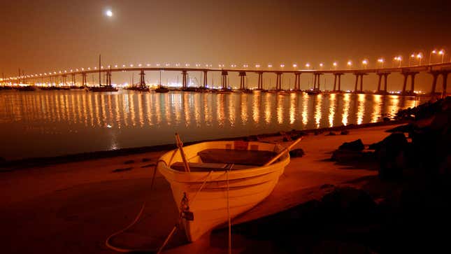 A photo of a bridge in California at sunset. 