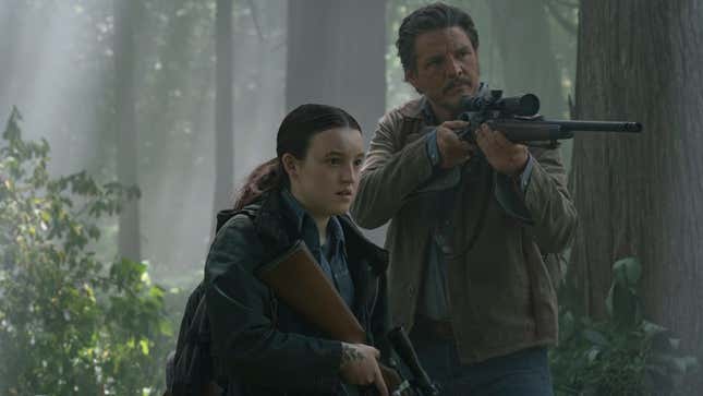 Joel and Ellie look at something off-screen while Joel trains his rifle on whatever they're looking at.