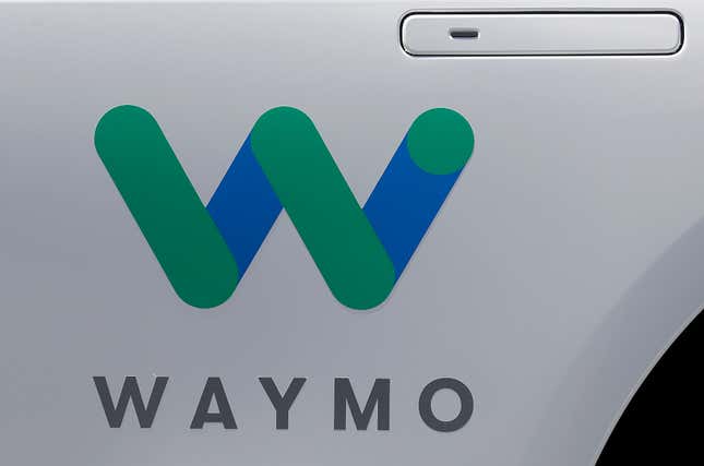 FILE - In this May 8, 2018, file photo, a Waymo logo is displayed on the door of a car at the Google I/O conference in Mountain View, Calif. Waymo is issuing a recall for the first time due to a software concern after two of its self-driving vehicles hit the same pickup truck that was being towed. (AP Photo/Jeff Chiu, File)