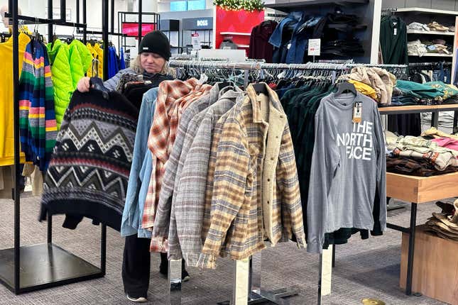 A shopper looks at outerwear at a store in Schaumburg, Ill., Monday, Dec. 18, 2023. On Wednesday, the Commerce Department releases U.S. retail sales data for December. (AP Photo/Nam Y. Huh)