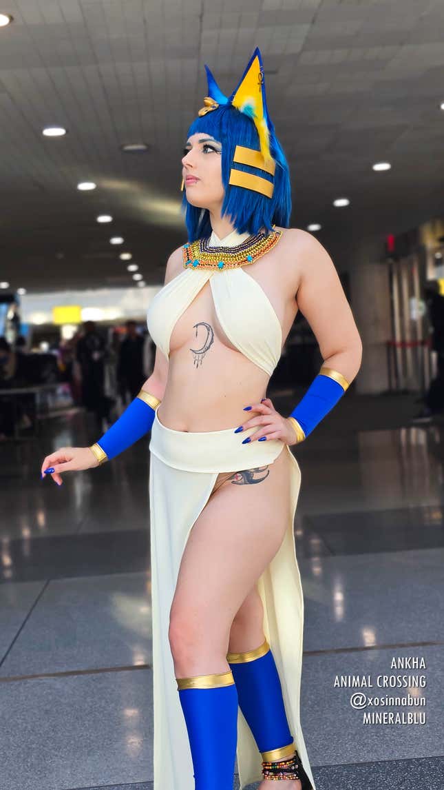 An Ankha cosplayer stands regally at Anime NYC 2023.