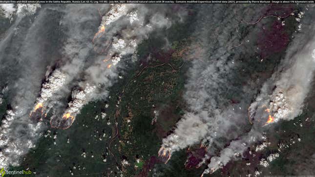 A satellite image showing multiple fires burning over an area larger than 100 miles (175 kilometers) wide and releasing major smoke plumes in Siberia.
