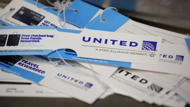 A pile of United Airlines bag tags