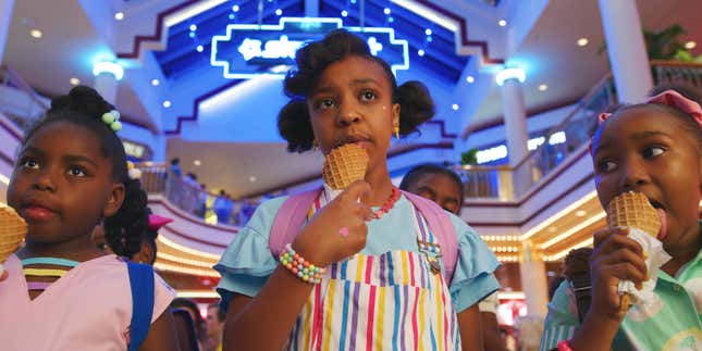 This image released by Netflix shows Priah Ferguson, center, in a scene from &quot;Stranger Things.&quot; The scene was shot on location at the Gwinnett Place Mall in Duluth, Ga. (Netflix via AP)