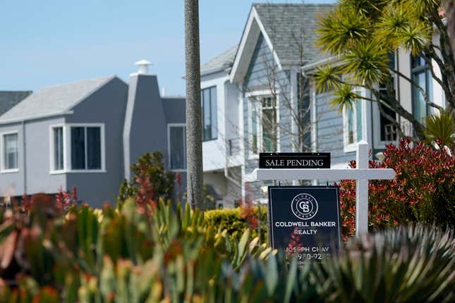 FILE - A Sale Pending sign hangs in front of a property in San Francisco, Tuesday, April 18, 2023. Planning a wedding and buying a home are two of the most expensive milestones of adult life, and couples with both of these goals may wonder how they’ll pay for it all. After all, new mortgages cost more now than ever, and wedding catering alone can easily cost five figures. (AP Photo/Jeff Chiu, File)