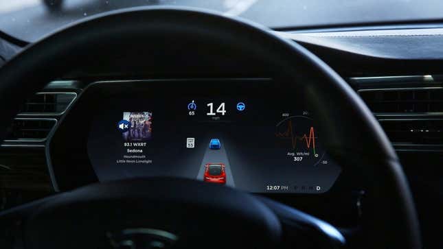 A photo of a dashboard showing Tesla Autopilot running. 