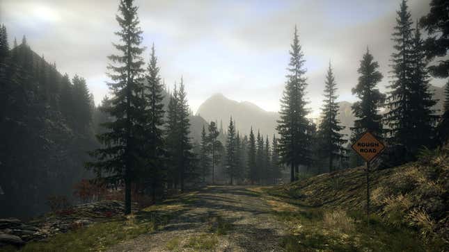 Trees and an empty road in the game Alan Wake.