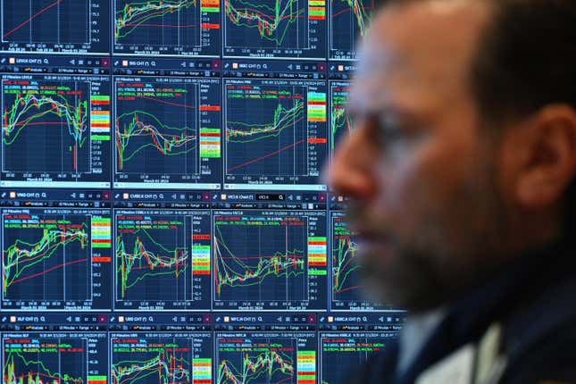 A trader works on the floor of the New York Stock Exchange during morning trading on March 4.