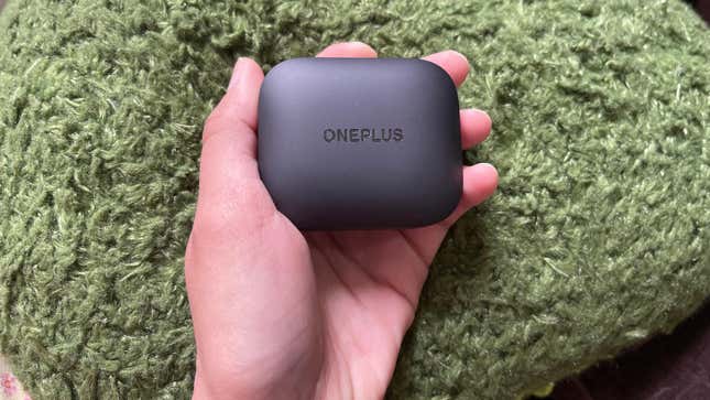 A photo of a person holding the OnePlus Buds 3.