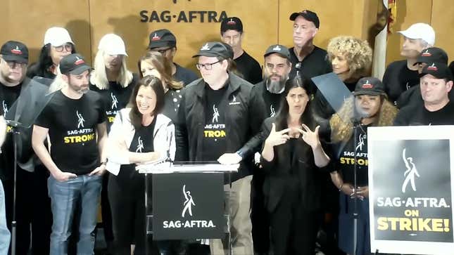 SAG-AFTRA National President Fran Drescher, centered right, and Chair of Negotiating Committee Duncan Crabtree-Ireland, standing to her left speak at the SAG-AFTRA press conference announcing an official strike on Thursday, July13, 2023 in Los Angeles.