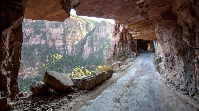 View of the Guoliang Tunnel through the Wanxian Mountain in the Taihang Mountains in Huixian county, Xinxiang city, central China's Henan province, 7 November 2017. A road winds through a cliff in Xinxiang, Henan Province.