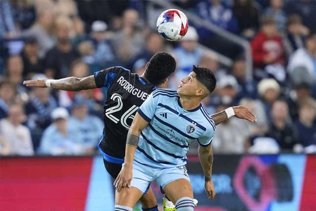 Oct 25, 2023; Kansas City, KS, USA; Sporting Kansas City forward Alan Pulido (9) battles San Jose Earthquakes defender Rodrigues (26) for the ball in the second half in the Western Conference Wild Card match of the 2023 MLS Cup Playoffs at Children&#39;s Mercy Park.