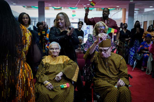 WASHINGTON, DC - FEBRUARY 28: Viola Ford Fletcher, 108, L, and Hughes Van Ellis, 102, are sworn in as citizens of Ghana at the Embassy of Ghana on February 28, 2023, in Washington, DC. Viola Fletcher and Hughes Van Ellis survived the 1921 Tulsa race massacre when White mobs and officials reportedly killed hundreds of Black residents. The centenarians were young children when White Tulsans formed a mob and attacked the Greenwood District, a thriving Black hub of commerce and home to multiple millionaires. Ghana is granting them citizenship in a ceremony organized by a group called Beyond the Return, which is ran by the Ghana Tourism Authority. 