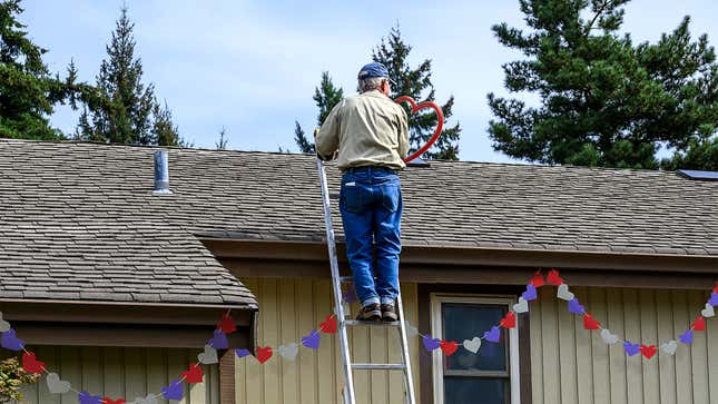 Image for article titled Elderly Neighbor Standing On Top Of 20-Foot Ladder To Hang Valentine’s Decorations