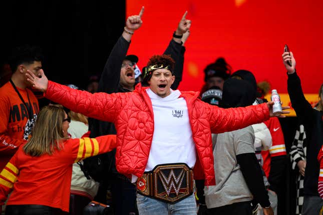 File - Kansas City Chiefs Patrick Mahomes, wearing a WWE belt, celebrates the team&#39;s Super Bowl victory at a gathering in Kansas City, Mo., Wednesday, Feb. 15, 2023. The WWE is collaborating with the Big 12 Conference for their championship game next month, as the sports entertainment company further strengthens its relationship with various sports organizations. The Dr. Pepper Big 12 Football Championship will be held on Dec. 2, 2023 at AT&amp;T Stadium in Arlington, Texas. (AP Photo/Reed Hoffmann, File)