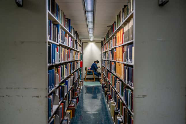 A person reads at the Rice University Library on April 26, 2022, in Houston, Texas. A group of local residents are suing Llano County in federal court for the County’s removal and censorship of library books addressing racism and LGBTQ issues. The lawsuit addresses “censorship of public libraries being a violation of the first and fourteenth amendments” and comes as conservatives continue to seek and implement restrictions on children’s content covering American history, racism, and LGBTQ issues.