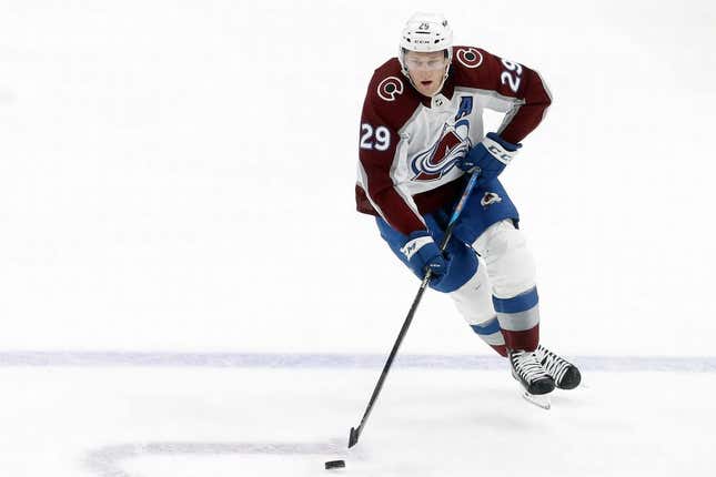 Oct 26, 2023; Pittsburgh, Pennsylvania, USA; Colorado Avalanche center Nathan MacKinnon (29) skates up ice with the puck against the Pittsburgh Penguins during the second period at PPG Paints Arena. The Penguins shutout the Avalanche 4-0.
