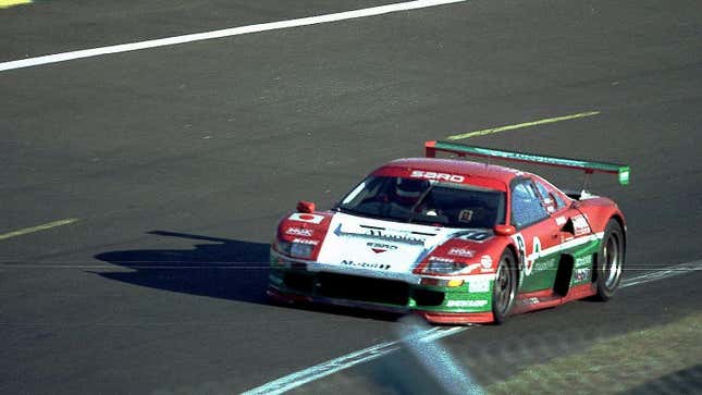 Side-quarter spectator photo of a SARD MC8-R on track.