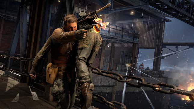 The protagonist of Sniper Elite: Resistance carries a body while fireing a gun.