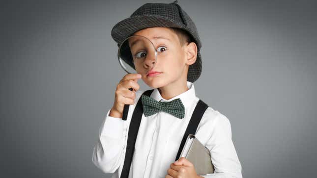 Child wearing a deerstalker hat 
