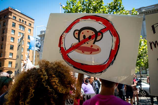 People hold signs during a rally to demand that the federal government respond quickly to the recent San Francisco monkeypox outbreak at the San Francisco Federal Building on July 18, 2022 in San Francisco, California. The rally, held to call for the Centers for Disease Control &amp; Prevention and the U.S. Department of Health &amp; Human Services to increase access to vaccines, ensure equity in vaccine and testing distribution and fight stigma against the LGBTQ+ community, was co-hosted by groups including the Alice B. Toklas LGBTQ Democratic Club, Harvey Milk LGBTQ Democratic Club and San Francisco AIDS Foundation. 