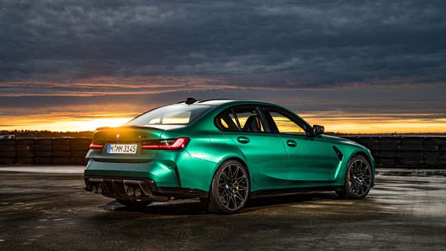 A photo of the rear quarter of the BMW M3 in green. 