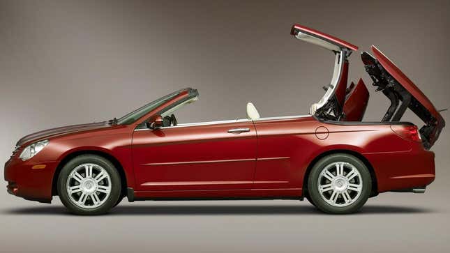 A final generation Chrysler Sebring convertible with the roof midway folded down