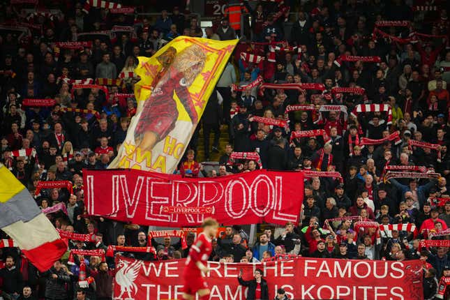 Liverpool fans cheer ahead of the English League Cup third round soccer match between Liverpool and Leicester City at the Anfield stadium in Liverpool, England, Wednesday, Sept. 27, 2023. (AP Photo/Jon Super)