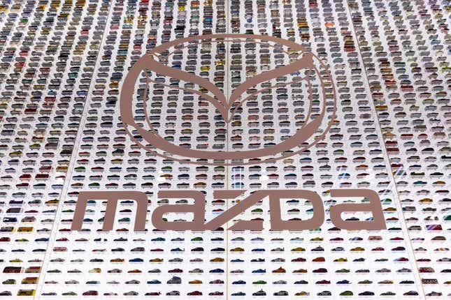 Japanese car maker Mazda company logo at their exhibition area during the Japan Mobility Show 2023 in Tokyo Big Sight