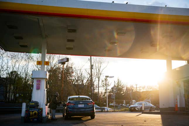 A driver pumps gas at a Shell gas station in Washington, DC, US, on Tuesday, Nov. 28, 2023