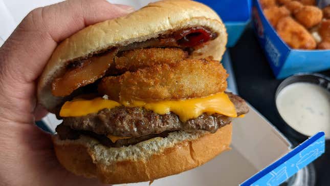 Loaded A1 Stackburger at DQ with onion rings on it