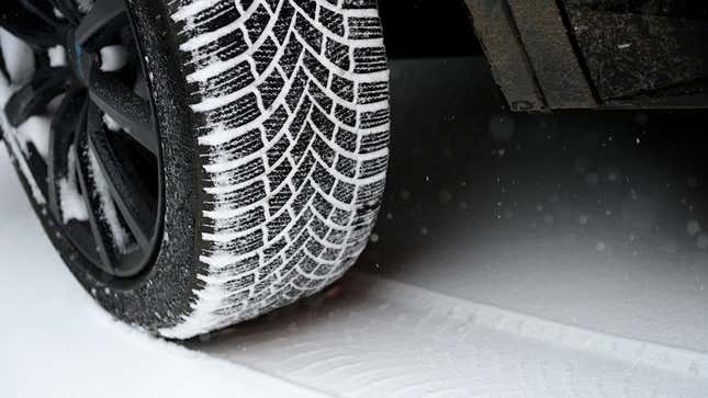 Snow tires leave a trail in the snow 