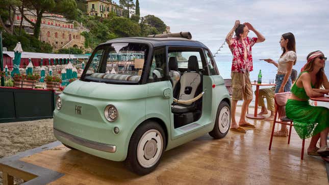 A mint green Fiat Topolino compact hatchback