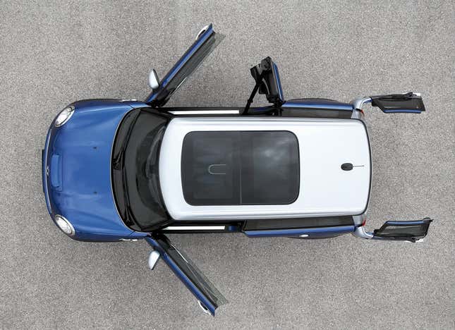 An overhead view of a Mini Cooper Clubman with all of its doors open, including the twin rear barn doors and the passenger side 1/4 door.