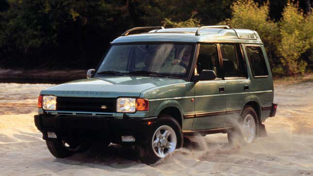 A photo of a pale green Land Rover Discovery SUV. 