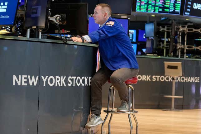 FILE - Traders work on the floor at the New York Stock Exchange in New York, Friday, June 2, 2023. (AP Photo/Seth Wenig, File)