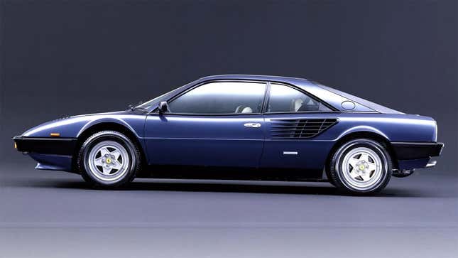Blue Ferrari Mondial viewed from side, in a studio.